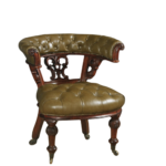Antique Victorian leather wingback desk chair in sage-green leather