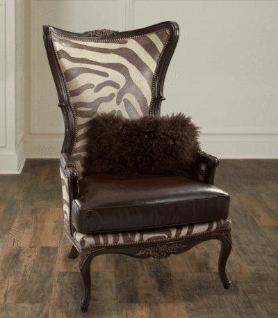 Teak Safari Armchair – solid teak frame with zebra-print leather and brass nailhead trim