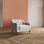 Lumi Armchair – solid teak wood frame with brass-capped tapered legs and button-tufted upholstered seat