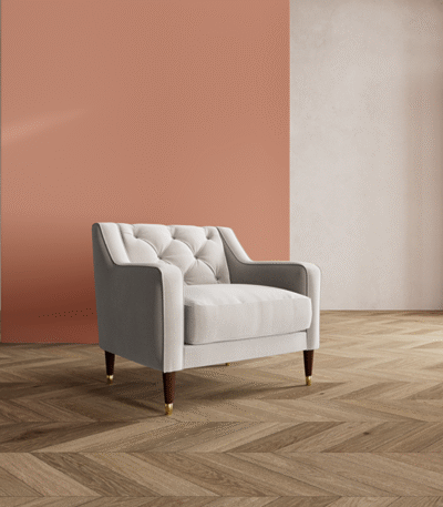 Lumi Armchair – solid teak wood frame with brass-capped tapered legs and button-tufted upholstered seat